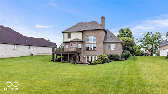 14711 Macduff Dr, Noblesville, IN 46062 - rear view of property featuring a lawn, a chimney, a deck, and brick siding