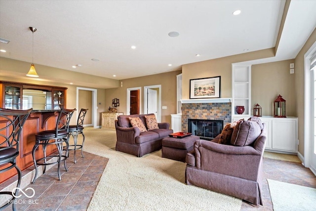 14711 Macduff Dr, Noblesville, IN 46062 - carpeted living area featuring a fireplace, recessed lighting, and baseboards