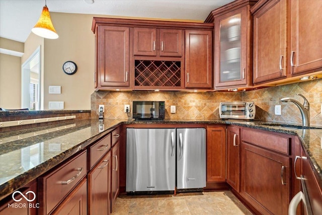 14711 Macduff Dr, Noblesville, IN 46062 - bar area with freestanding refrigerator, hanging light fixtures, a sink, black microwave, and tasteful backsplash