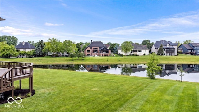 14711 Macduff Dr, Noblesville, IN 46062 - view of grassy yard featuring a residential view and a deck with water view