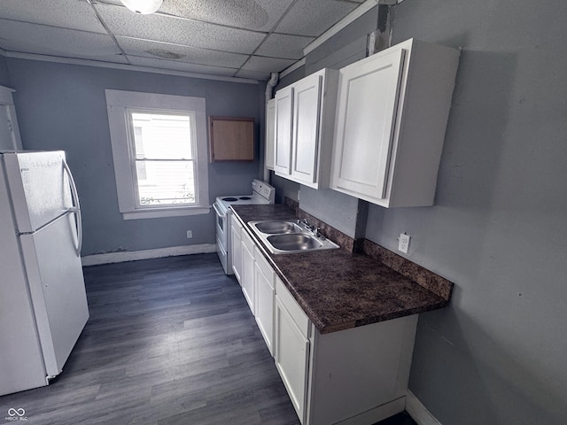 3502 N Kenwood Ave, Indianapolis, IN 46208 - kitchen featuring white appliances, a sink, dark countertops, white cabinets, and baseboards