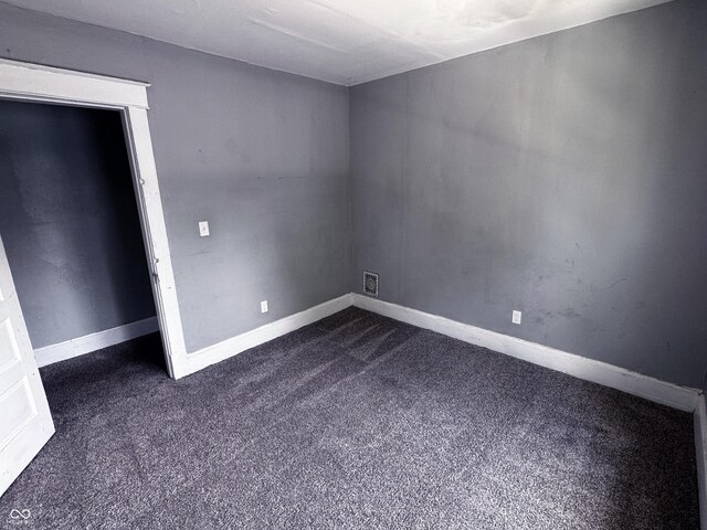 3502 N Kenwood Ave, Indianapolis, IN 46208 - unfurnished room featuring dark colored carpet and baseboards