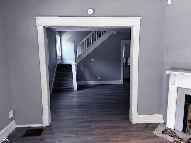 3502 N Kenwood Ave, Indianapolis, IN 46208 - stairs featuring a brick fireplace, baseboards, and wood finished floors