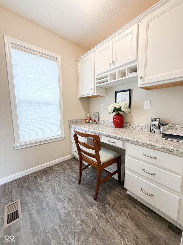 9903 Deep Royal Way, Indianapolis, IN 46239 - kitchen featuring white cabinetry, dark wood-style floors, and baseboards