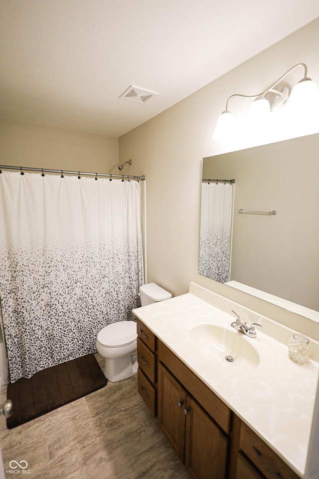9903 Deep Royal Way, Indianapolis, IN 46239 - bathroom featuring vanity, toilet, wood finished floors, and a shower with shower curtain