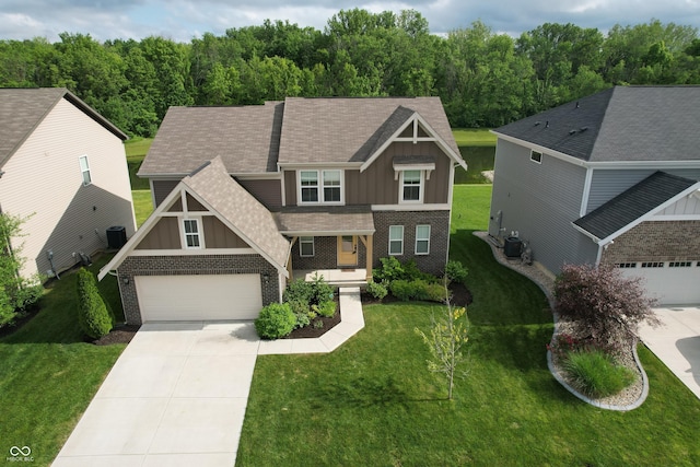9903 Deep Royal Way, Indianapolis, IN 46239 - craftsman-style home featuring board and batten siding, brick siding, driveway, a front yard, and a shingled roof