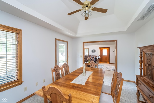 4399 Summerhaven Dr, New Palestine, IN 46163 - dining area with light carpet, a raised ceiling, baseboards, and ceiling fan