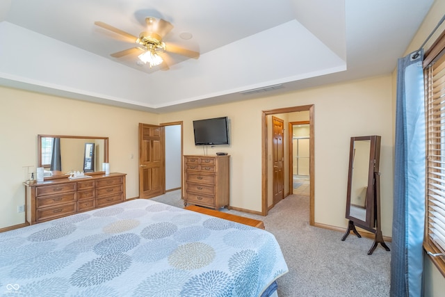 4399 Summerhaven Dr, New Palestine, IN 46163 - bedroom featuring a tray ceiling, carpet, baseboards, and ceiling fan