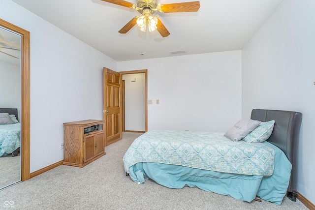 4399 Summerhaven Dr, New Palestine, IN 46163 - bedroom with light carpet, ceiling fan, and baseboards