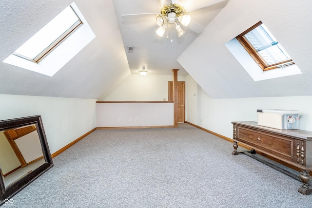 4399 Summerhaven Dr, New Palestine, IN 46163 - bonus room featuring a skylight, carpet floors, lofted ceiling, and baseboards