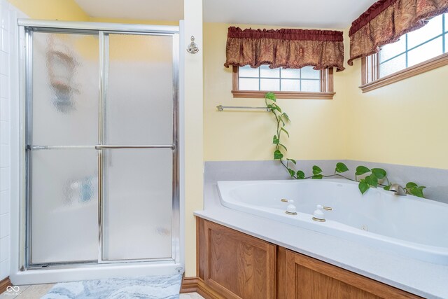 4399 Summerhaven Dr, New Palestine, IN 46163 - full bathroom featuring a shower stall and a tub with jets