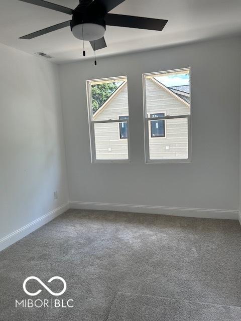 2936 Guilford Ave, Indianapolis, IN 46205 - carpeted empty room featuring ceiling fan and baseboards