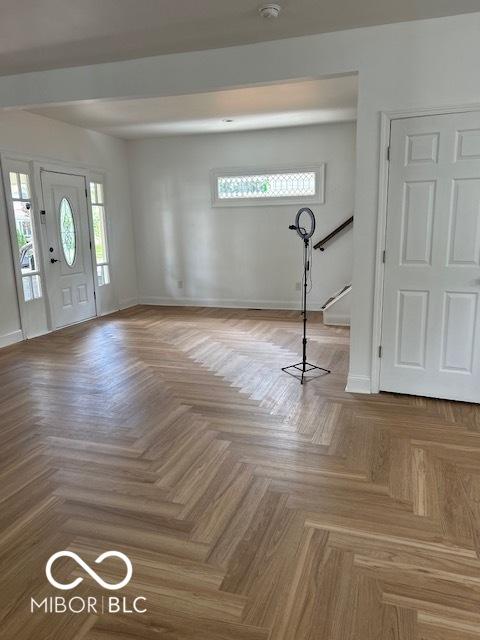 2936 Guilford Ave, Indianapolis, IN 46205 - entrance foyer with stairway, healthy amount of natural light, and baseboards