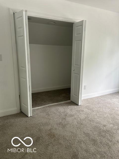 2936 Guilford Ave, Indianapolis, IN 46205 - unfurnished bedroom featuring carpet and baseboards
