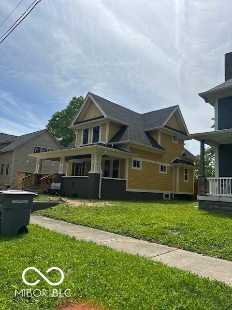 2936 Guilford Ave, Indianapolis, IN 46205 - view of property exterior featuring a lawn and a porch