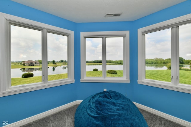 5758 N 900 W, Thorntown, IN 46071 - sitting room with a water view, carpet floors, baseboards, and plenty of natural light