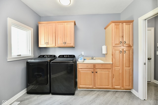 5758 N 900 W, Thorntown, IN 46071 - laundry room with separate washer and dryer, cabinet space, light wood-type flooring, and baseboards