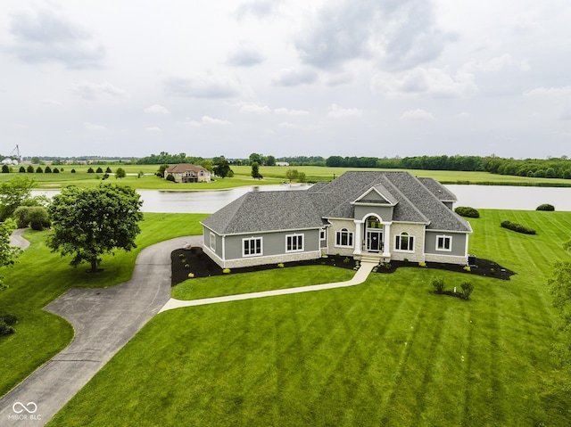 5758 N 900 W, Thorntown, IN 46071 - view of front of property with a water view, a front lawn, a shingled roof, and driveway