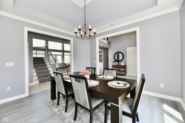 5758 N 900 W, Thorntown, IN 46071 - dining area featuring a tray ceiling, a chandelier, stairway, baseboards, and ornamental molding