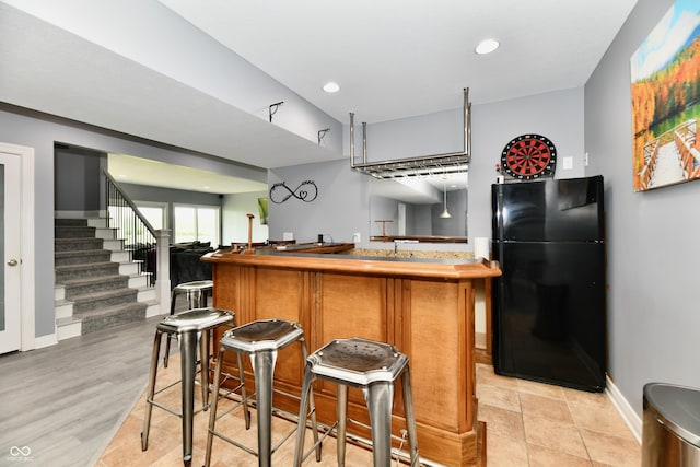 5758 N 900 W, Thorntown, IN 46071 - indoor wet bar featuring freestanding refrigerator, stairway, recessed lighting, and baseboards