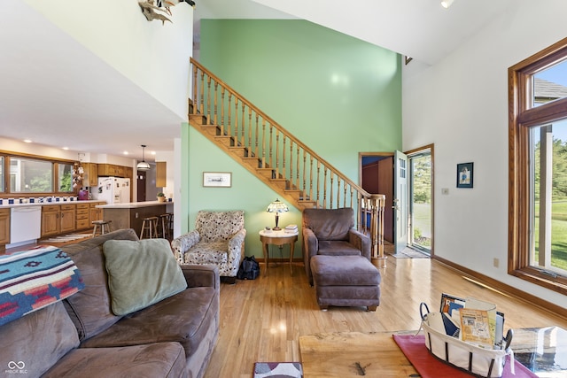 11875 W 700 S, Columbus, IN 47201 - living area with a towering ceiling, plenty of natural light, stairway, light wood-style floors, and recessed lighting