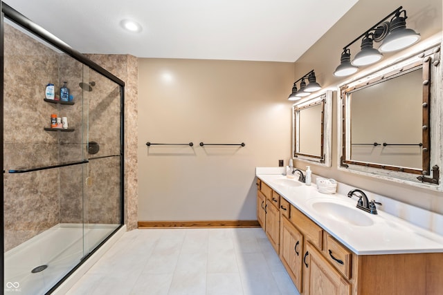 11875 W 700 S, Columbus, IN 47201 - bathroom with baseboards, double vanity, a shower stall, and tile patterned flooring