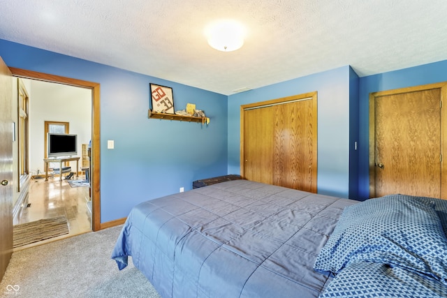 11875 W 700 S, Columbus, IN 47201 - bedroom with a closet, light colored carpet, and a textured ceiling