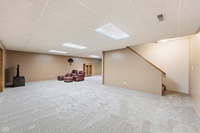11875 W 700 S, Columbus, IN 47201 - finished below grade area with a wood stove, carpet, a drop ceiling, and stairs