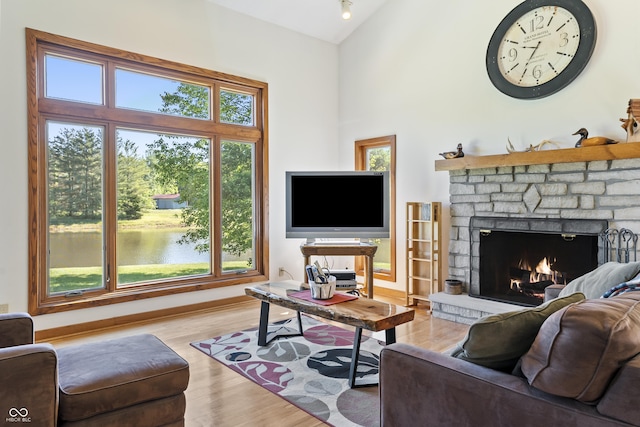 11875 W 700 S, Columbus, IN 47201 - living room with a fireplace, wood finished floors, and high vaulted ceiling