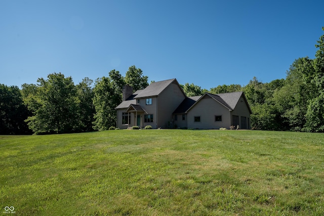 11875 W 700 S, Columbus, IN 47201 - exterior space featuring a lawn, a chimney, and a garage