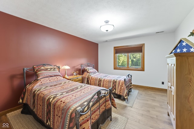 11875 W 700 S, Columbus, IN 47201 - bedroom featuring light wood finished floors and baseboards