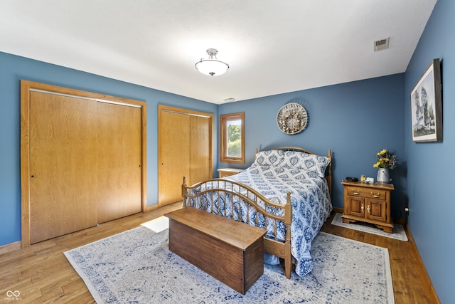 11875 W 700 S, Columbus, IN 47201 - bedroom with two closets, wood finished floors, and baseboards