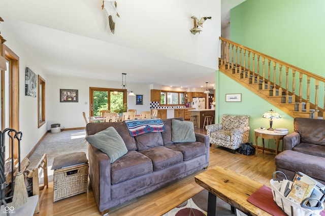 11875 W 700 S, Columbus, IN 47201 - living room with stairway, light wood-style floors, and baseboards