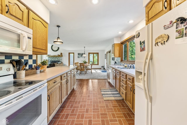 11875 W 700 S, Columbus, IN 47201 - kitchen with white appliances, brick patterned flooring, light countertops, recessed lighting, and tasteful backsplash