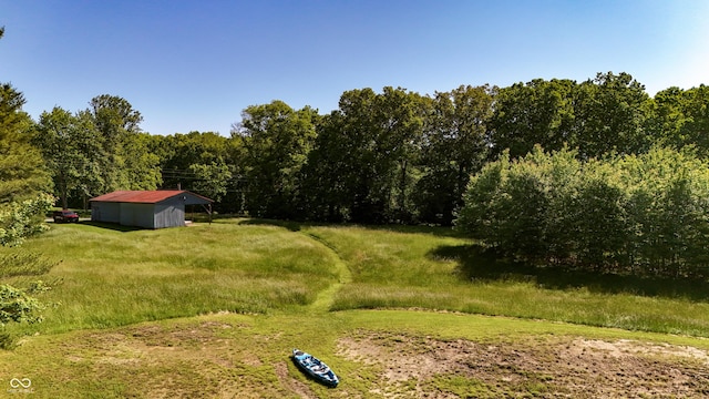 11875 W 700 S, Columbus, IN 47201 - view of yard with an outdoor structure, a forest view, and an outbuilding
