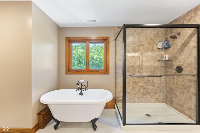 11875 W 700 S, Columbus, IN 47201 - bathroom with a freestanding tub, a shower stall, baseboards, and tile patterned flooring