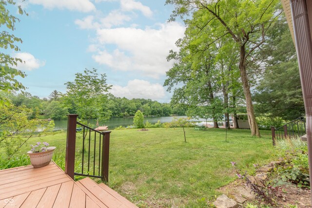 5821 Bittersweet Rd, Morgantown, IN 46160 - view of grassy yard with a deck with water view