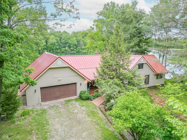 5821 Bittersweet Rd, Morgantown, IN 46160 - view of front of property with driveway, a garage, and metal roof