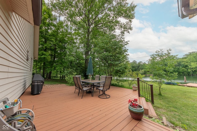 5821 Bittersweet Rd, Morgantown, IN 46160 - deck featuring a water view, a yard, outdoor dining space, and view of scattered trees