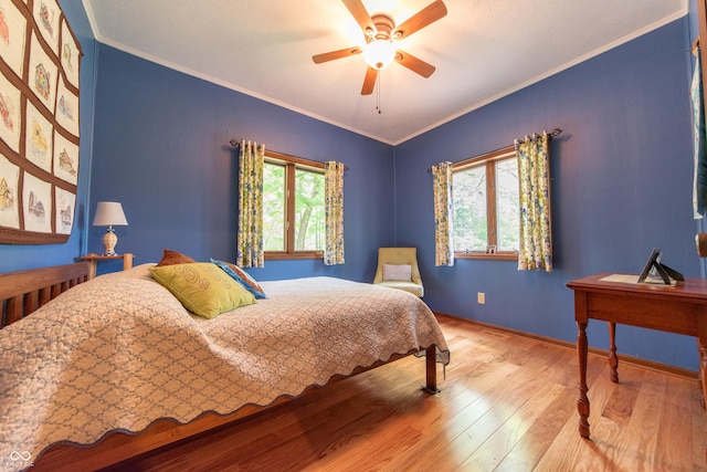 5821 Bittersweet Rd, Morgantown, IN 46160 - bedroom with hardwood / wood-style floors, baseboards, crown molding, and ceiling fan
