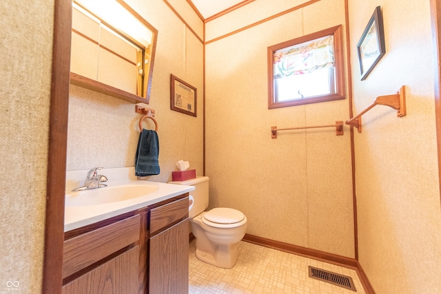 5821 Bittersweet Rd, Morgantown, IN 46160 - bathroom with toilet, vanity, and baseboards
