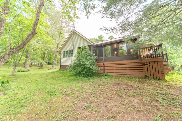 5821 Bittersweet Rd, Morgantown, IN 46160 - back of property with a sunroom, metal roof, stairs, and a standing seam roof