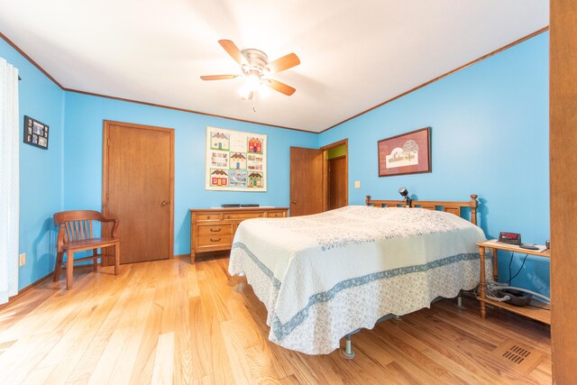 5821 Bittersweet Rd, Morgantown, IN 46160 - bedroom featuring light wood finished floors, ceiling fan, and ornamental molding