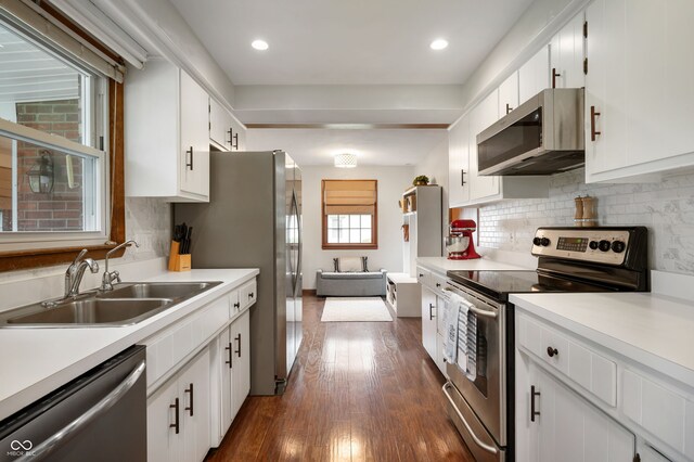 1495 E 240 N, Anderson, IN 46012 - kitchen with stainless steel appliances, a sink, dark wood-type flooring, light countertops, and white cabinetry