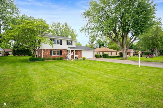 1495 E 240 N, Anderson, IN 46012 - traditional-style home featuring asphalt driveway, an attached garage, a chimney, a front lawn, and brick siding