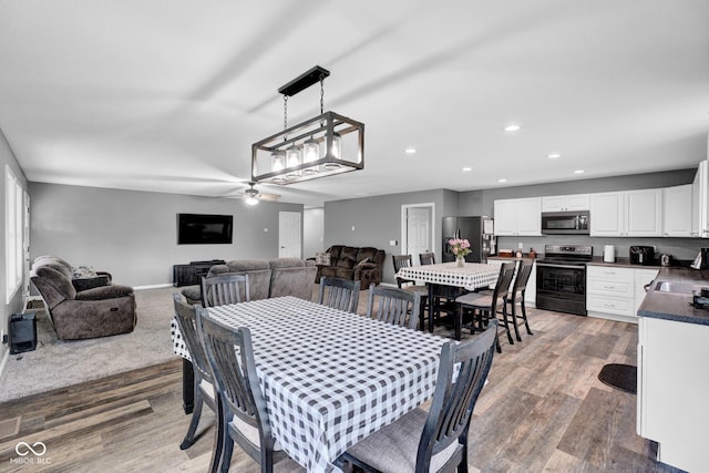 1295 Colonial Dr, Seymour, IN 47274 - dining space featuring recessed lighting, wood finished floors, and a ceiling fan