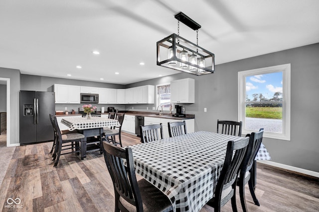 1295 Colonial Dr, Seymour, IN 47274 - dining space featuring wood finished floors and recessed lighting