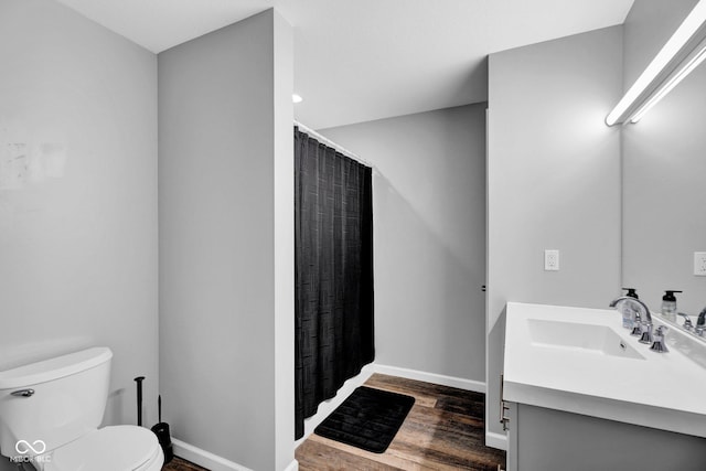 1295 Colonial Dr, Seymour, IN 47274 - full bathroom with vanity, wood finished floors, and a shower with shower curtain