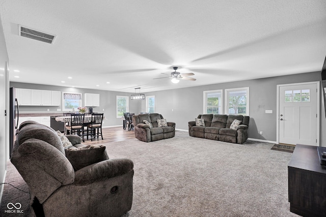 1295 Colonial Dr, Seymour, IN 47274 - carpeted living room featuring healthy amount of natural light, a ceiling fan, and recessed lighting