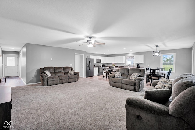 1295 Colonial Dr, Seymour, IN 47274 - living room featuring ceiling fan, light colored carpet, and recessed lighting